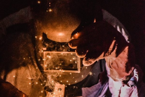 person welding metal